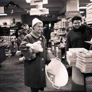 Customers in the 1968 newly opened consumer department store on Bruehl in Richard-Wagner-Strasse in central Leipzig. At that time the largest department store in the GDR, popularly called 'tin can', because of the aluminum shell of the outer facade made in honeycomb patterns, which unfortunately heated up the house very much. Customers in the 1968 newly opened consumer department store on Bruehl in Richard-Wagner-Strasse in central Leipzig. At that time the largest department store in the GDR, popularly called 'tin can', because of the aluminum shell of the outer facade made in honeycomb patterns, which unfortunately heated up the house very much.